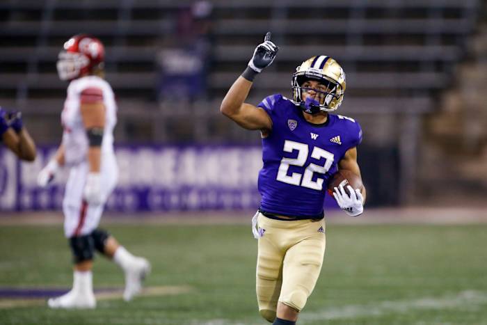 Nov 28, 2020; Seattle, Washington, USA; Washington Huskies defensive back Trent McDuffie (22) celebrates following an interception against the Utah Utes during the fourth quarter at Alaska Airlines Field at Husky Stadium. Mandatory Credit: Joe Nicholson-USA TODAY Sports